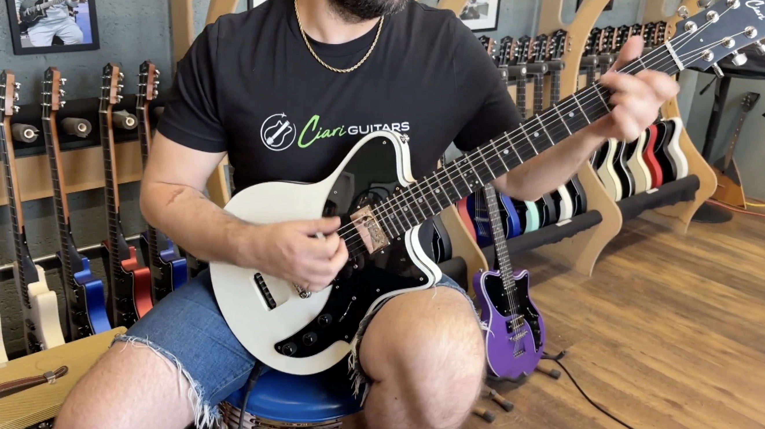 Musician playing an Olympic White Ascender Trio Plus